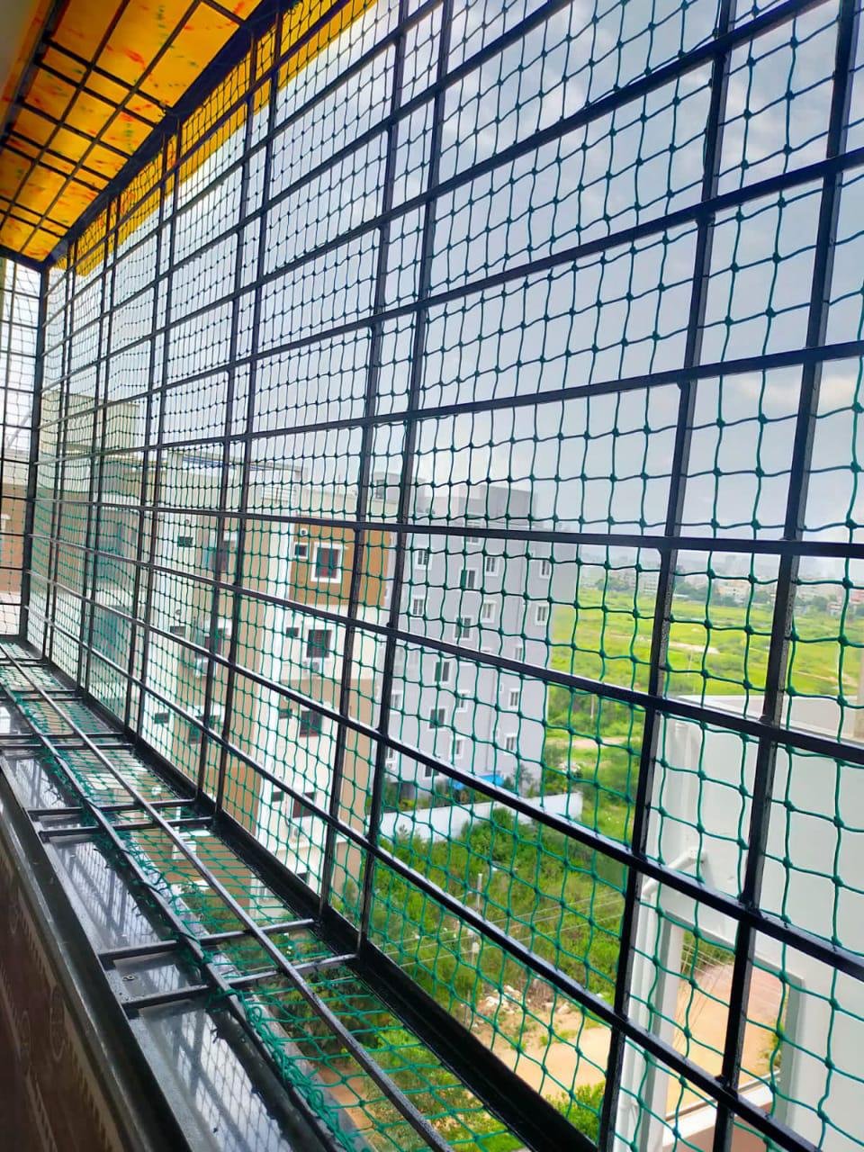 Real bird protection net across a residential balcony